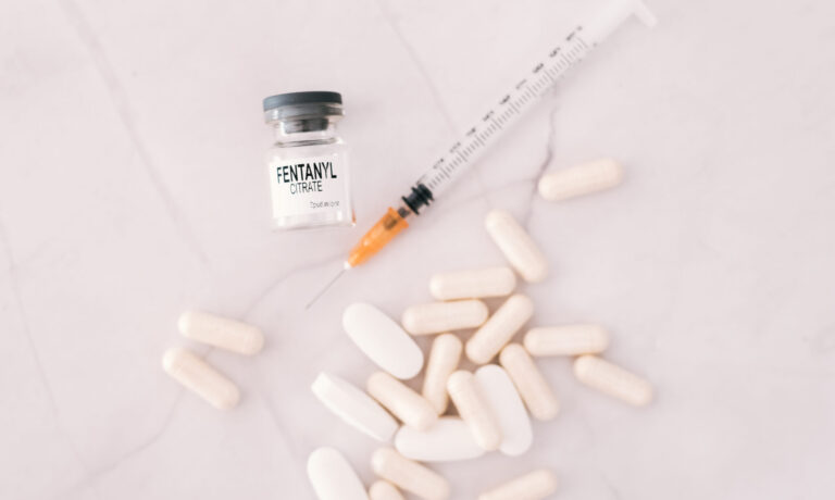 Vial and pills of fentanyl, an opioid responsible for the drug a