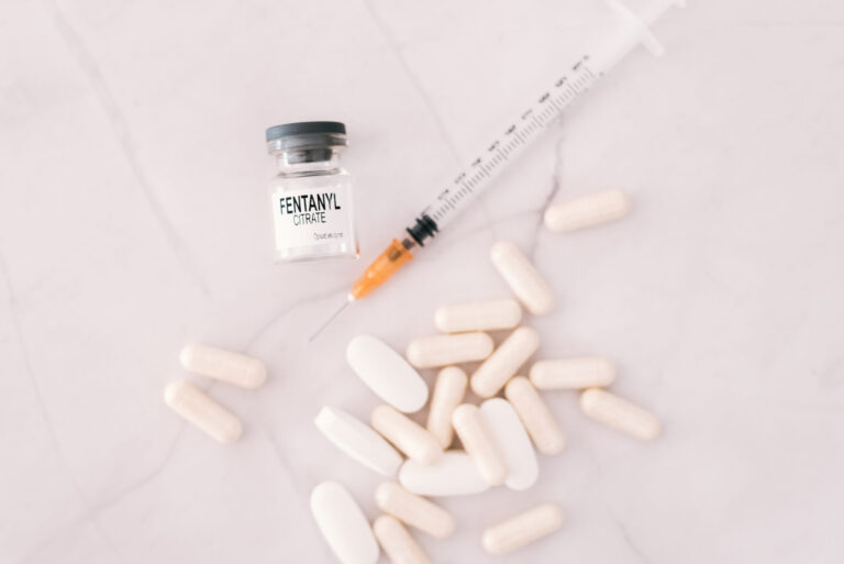 Vial and pills of fentanyl, an opioid responsible for the drug a